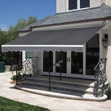Black and white colored awning in front of home in Cook County IL rijon manufactoring company