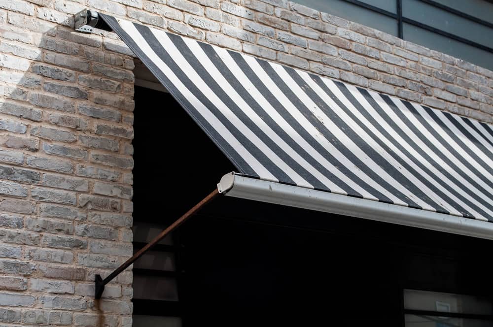 Striped black and white Retractable Awning rijon manufactoring company